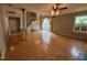 Spacious living room with hardwood floors, large windows, chandelier and an open floor plan great for entertaining at 10415 Neland, Raleigh, NC 27614