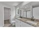 Bathroom features double sinks with granite countertops, white cabinets, and a glass-enclosed shower at 106 Flue Ct, Oxford, NC 27565