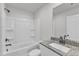 Bathroom showcasing a tub-shower combination and granite vanity at 106 Flue Ct, Oxford, NC 27565