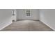 Neutral bedroom with plush carpeting, a large window, and ample natural light at 106 Flue Ct, Oxford, NC 27565