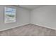 Bedroom featuring a large window and neutral-toned carpet and paint at 106 Flue Ct, Oxford, NC 27565