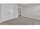 View of carpeted bedroom with closet space and an adjoining doorway at 106 Flue Ct, Oxford, NC 27565