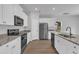 Well-equipped kitchen features stainless steel appliances, granite countertops, and ample cabinet space at 106 Flue Ct, Oxford, NC 27565