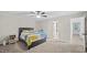 Bedroom with a comfortable bed, carpet, and an adjacent ensuite bathroom through a door at 11 Willow Bridge Dr, Durham, NC 27707