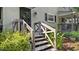 Charming entrance with wooden stairs and green siding at 11 Willow Bridge Dr, Durham, NC 27707