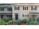 Charming townhome with a welcoming front door, wooden steps, and well-maintained landscaping at 11 Willow Bridge Dr, Durham, NC 27707
