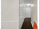 Hallway with gleaming hardwood floors, crown molding and white paneled doors at 11 Willow Bridge Dr, Durham, NC 27707