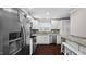 Modern kitchen featuring stainless steel appliances, granite counters and white cabinetry at 11 Willow Bridge Dr, Durham, NC 27707