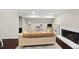 Cozy living room features a fireplace, plush seating and playroom area at 11 Willow Bridge Dr, Durham, NC 27707