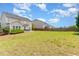 Large backyard with manicured lawn offers ample space for outdoor activities and relaxation at 1108 Forest Willow Ln, Morrisville, NC 27560