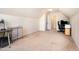 Finished bonus room with a vaulted ceiling and desk set up at 1108 Forest Willow Ln, Morrisville, NC 27560