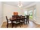 Elegant dining room with hardwood floors, chandelier, and bay window, perfect for entertaining at 1108 Forest Willow Ln, Morrisville, NC 27560