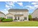 Exterior of the home features a well maintained backyard and lovely greenery at 1108 Forest Willow Ln, Morrisville, NC 27560