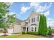 Inviting two-story home with manicured lawn, well-maintained landscaping, and attached two-car garage at 1108 Forest Willow Ln, Morrisville, NC 27560