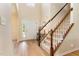 Bright foyer with hardwood floors, staircase, and high ceilings creating a grand entrance at 1108 Forest Willow Ln, Morrisville, NC 27560
