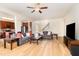 Spacious living area with wood floors, open layout, and seamless flow to kitchen and staircase at 1108 Forest Willow Ln, Morrisville, NC 27560