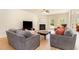 Comfortable living room with hardwood floors, fireplace, and plenty of natural light at 1108 Forest Willow Ln, Morrisville, NC 27560