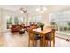 Bright living room and dining area features large windows and comfortable seating at 1108 Forest Willow Ln, Morrisville, NC 27560