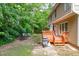 Outdoor entertaining space with a deck, patio, grill, fire pit, and seating at 113 Chestone Ct, Cary, NC 27513