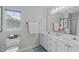 Bright bathroom with double sink vanity and a separate tub and shower at 113 Chestone Ct, Cary, NC 27513