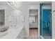Bright bathroom features a shower, a double sink vanity, and patterned tile flooring at 113 Chestone Ct, Cary, NC 27513