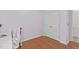 This bedroom has hardwood floors, double closets with white doors, and neutral paint at 113 Chestone Ct, Cary, NC 27513