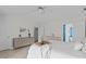 Light bedroom with stylish dressers, vaulted ceiling, and ensuite bathroom at 113 Chestone Ct, Cary, NC 27513