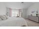 Cozy bedroom features neutral colors, wood floors, and ample natural light at 113 Chestone Ct, Cary, NC 27513
