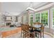 Open floor plan with a dining area, hardwood floors, adjacent living room with a fireplace at 113 Chestone Ct, Cary, NC 27513