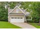 Charming two-story home with a neutral facade, a two-car garage, and a well-manicured lawn enhancing its curb appeal at 113 Chestone Ct, Cary, NC 27513