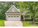 Charming home featuring a two-car garage, well-manicured lawn, and inviting front porch at 113 Chestone Ct, Cary, NC 27513