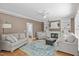 Cozy living room with fireplace, built-ins, a ceiling fan, and neutral paint, perfect for relaxation at 113 Chestone Ct, Cary, NC 27513