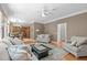 Bright living room open to kitchen offers a comfortable seating area and seamless flow for entertaining at 113 Chestone Ct, Cary, NC 27513