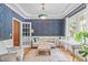 Stylish office with decorative wallpaper, hardwood floors, plush seating, and natural light at 113 Chestone Ct, Cary, NC 27513