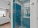 Modern shower with decorative tile and a glass door next to the main bedroom at 113 Chestone Ct, Cary, NC 27513