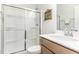 Bathroom features a shower, white countertop and wooden cabinets at 124 Airlie Place Ln, Willow Springs, NC 27592