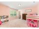 Cozy ' bedroom with a loft bed, shelving, and a colorful play area at 124 Airlie Place Ln, Willow Springs, NC 27592