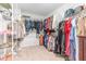 Walk-in closet with ample hanging space and shelving for organized storage at 124 Airlie Place Ln, Willow Springs, NC 27592