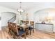 Elegant dining room with an arched entry and decorative cabinet at 124 Airlie Place Ln, Willow Springs, NC 27592