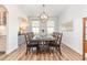 Elegant dining room with a stylish chandelier and a table set for a meal at 124 Airlie Place Ln, Willow Springs, NC 27592