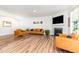 Spacious living room features a fireplace, large TV, and leather seating at 124 Airlie Place Ln, Willow Springs, NC 27592