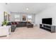 Spacious living room with large sofa and television at 124 Airlie Place Ln, Willow Springs, NC 27592