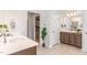 Main bathroom features dual vanities and access to the closet at 124 Airlie Place Ln, Willow Springs, NC 27592