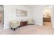 Sitting area featuring art and seating outside bathroom at 124 Airlie Place Ln, Willow Springs, NC 27592
