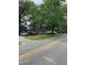 Quaint gray homes line a street, framed by mature trees and well-kept lawns at 12600 Old Stage Rd, Willow Springs, NC 27592