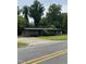 Suburban gray home featuring a driveway and manicured lawn in a tranquil neighborhood at 12600 Old Stage Rd, Willow Springs, NC 27592