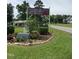 Panther Lake Venue sign featuring camping, fishing, and boat rentals, set amidst lush greenery and landscaping at 12600 Old Stage Rd, Willow Springs, NC 27592