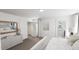 Bright bedroom featuring closet space, neutral decor, and carpeted floors at 1537 Piney Fls Dr, Wendell, NC 27591