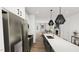 Stylish kitchen with stainless steel appliances, and a view of the living area at 1537 Piney Fls Dr, Wendell, NC 27591
