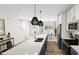 Well-lit kitchen with a long center island and stainless steel appliances at 1537 Piney Fls Dr, Wendell, NC 27591
